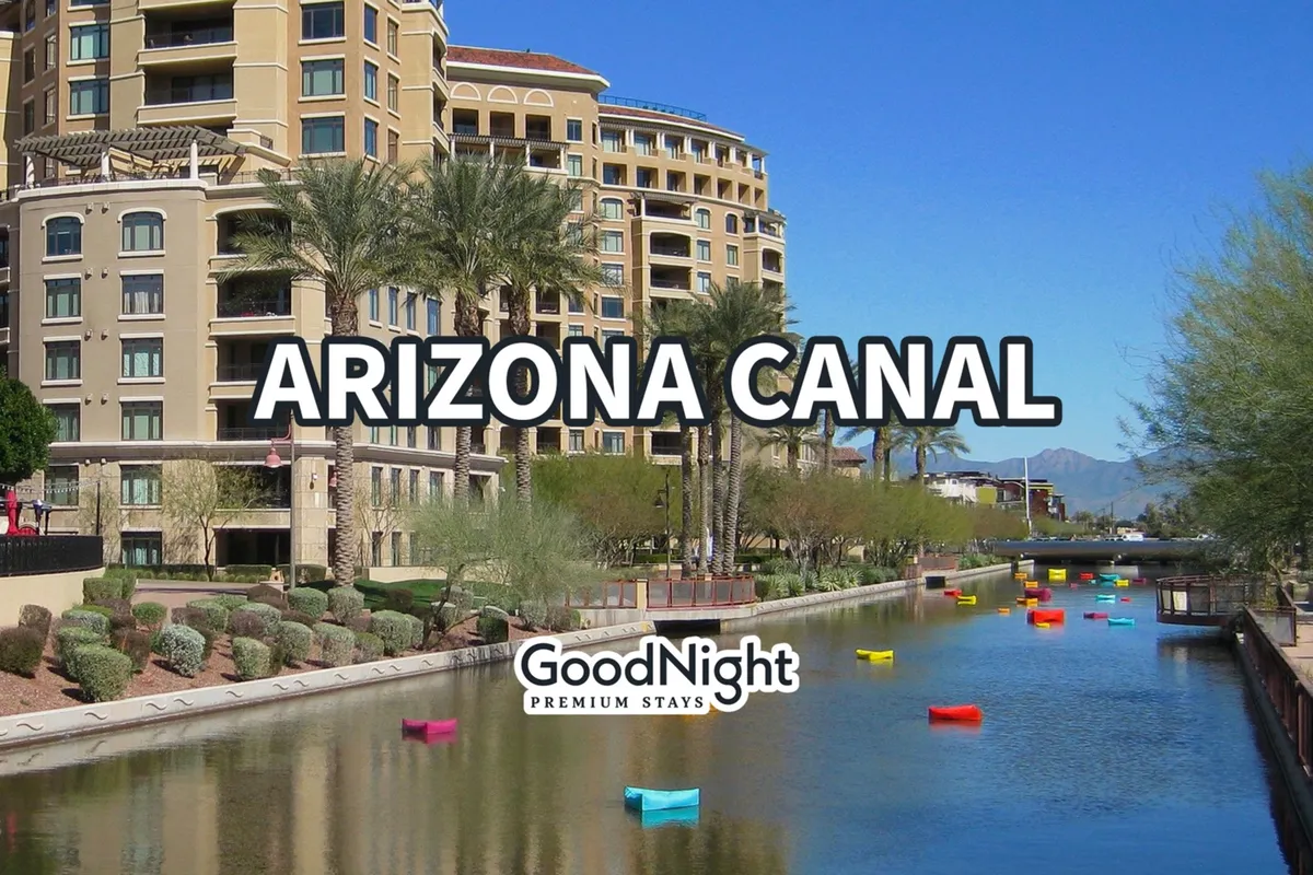 This image captures the Arizona Canal, bordered by palm trees and luxurious buildings, with colorful boats on the water. The canal path is lively and inviting, suggesting vibrant urban life and easy access to outdoor activities, shops, and restaurants.